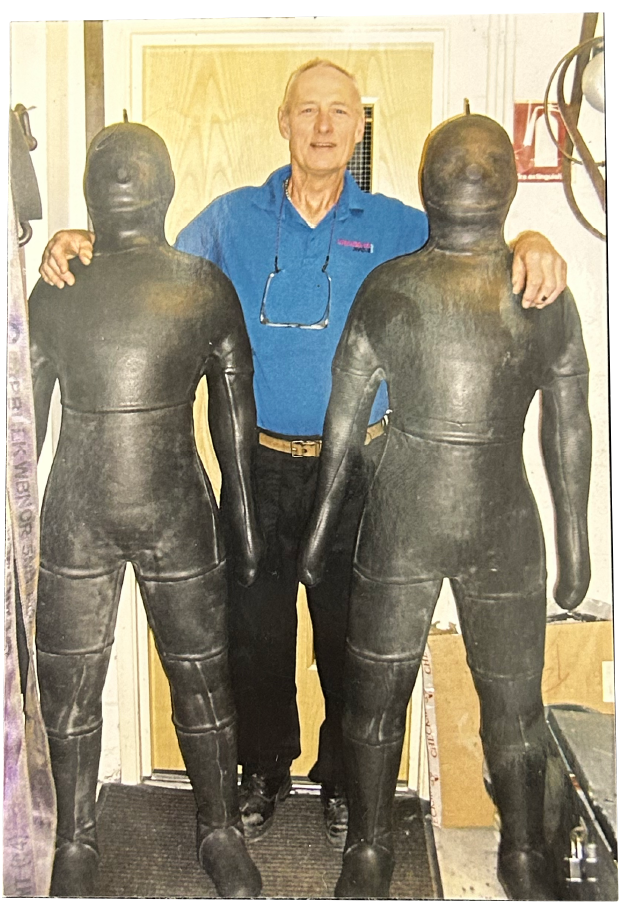 A photograph of Henry with the rubber men he made